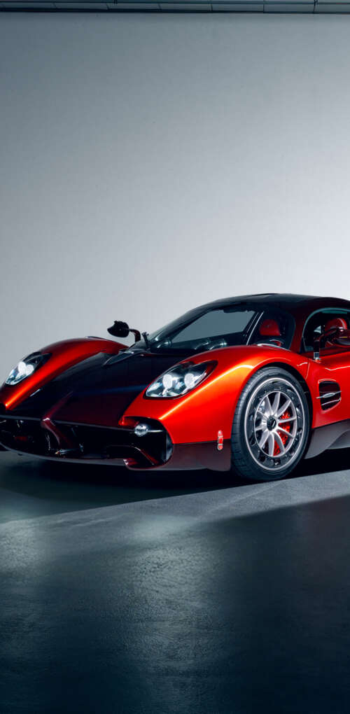 A high-performance red Pagani Utopia hypercar featuring sleek aerodynamic lines and... Huawei Mate 30 Pro cell phone backgrounds free