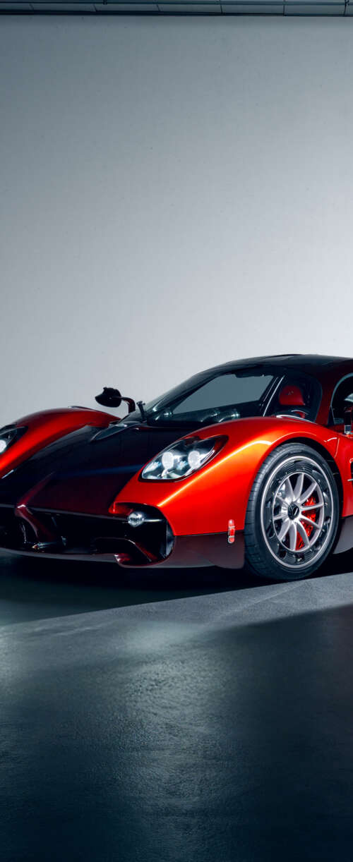 A high-performance red Pagani Utopia hypercar featuring sleek aerodynamic lines and... Samsung Galaxy Z Flip7 FE download free wallpaper for phone