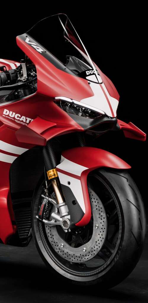 A cinematic close-up of a Ducati Superleggera V4 Centenario sports motorcycle against... Huawei Mate 30 Pro free background images
