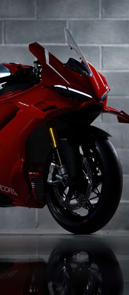 A sleek, red 2026 Ducati Panigale V4 R performance motorcycle with aerodynamic bodywork. Blackview XPLORE 1 Pro wallpaper images