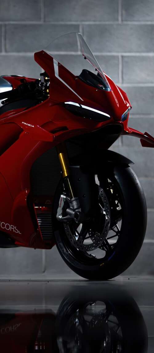 A sleek, red 2026 Ducati Panigale V4 R performance motorcycle with aerodynamic bodywork. Xiaomi Redmi 14C 5G free wallpaper