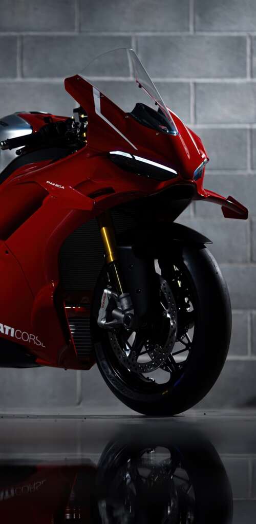 A sleek, red 2026 Ducati Panigale V4 R performance motorcycle with aerodynamic bodywork. Huawei Mate 30 Pro wallpaper images