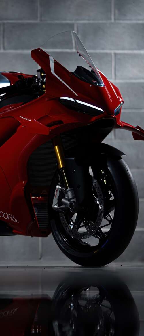 A sleek, red 2026 Ducati Panigale V4 R performance motorcycle with aerodynamic bodywork. nubia Flip 3 download free wallpaper for phone