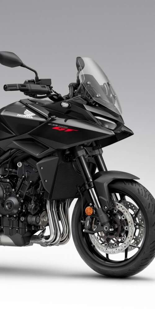 A sleek and modern black 2026 Honda CB1000GT touring motorcycle with a glossy finish. lock screen wallpaper