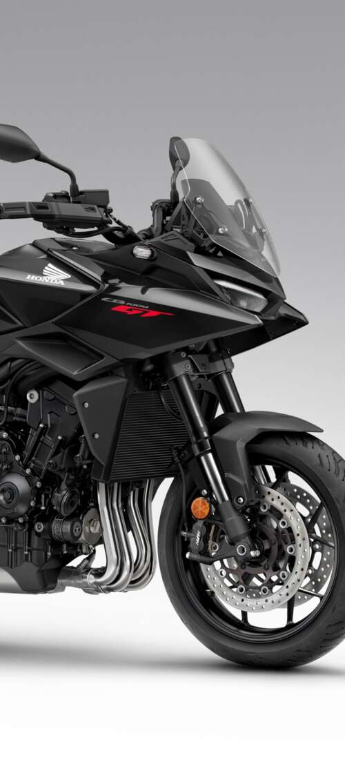 A sleek and modern black 2026 Honda CB1000GT touring motorcycle with a glossy finish. Tecno Spark Go 3 hand phone wallpaper