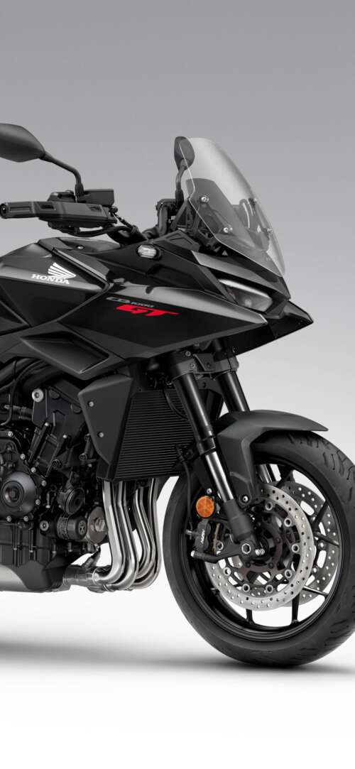 A sleek and modern black 2026 Honda CB1000GT touring motorcycle with a glossy finish. Xiaomi Redmi 15 4G free background images