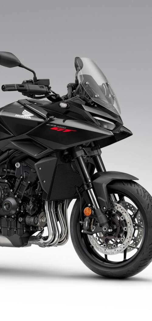 A sleek and modern black 2026 Honda CB1000GT touring motorcycle with a glossy finish. Oppo A6k 4G hand phone wallpaper