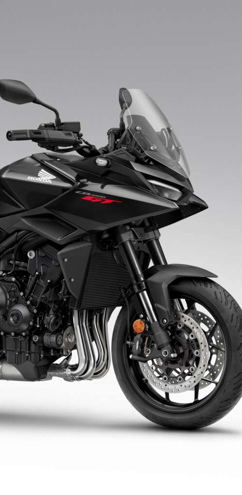A sleek and modern black 2026 Honda CB1000GT touring motorcycle with a glossy finish. Huawei Mate 30 Pro lock screen wallpaper