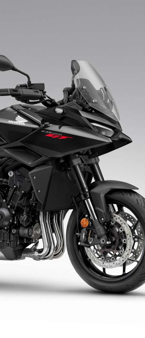 A sleek and modern black 2026 Honda CB1000GT touring motorcycle with a glossy finish. nubia Flip 3 high definition wallpaper