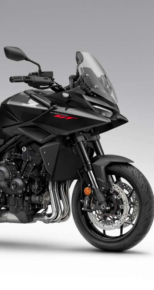 A sleek and modern black 2026 Honda CB1000GT touring motorcycle with a glossy finish. Sharp Aquos C10 lock screen wallpaper