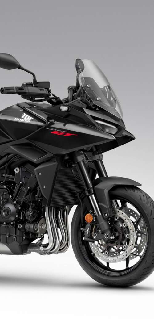 A sleek and modern black 2026 Honda CB1000GT touring motorcycle with a glossy finish. Samsung Galaxy S26 Ultra wallpaper photo gallery download