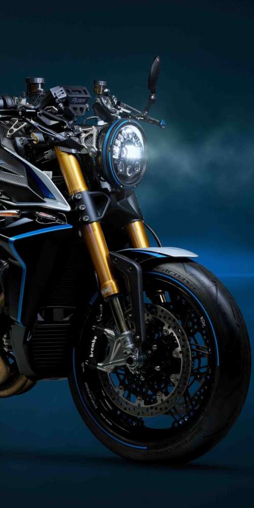A sleek, dark blue 2026 MV Agusta Rush Titanio naked motorcycle with high-end finishes. Ulefone Rugking 2 Pro