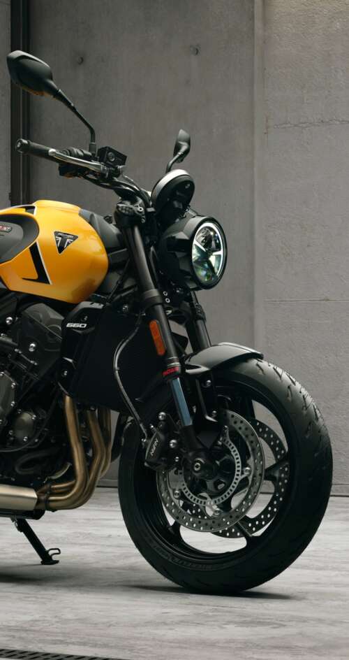High-detail 5K render of the 2026 Triumph Trident 660 naked motorcycle featuring... Sharp Aquos C10 wallpaper