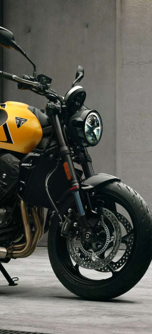 High-detail 5K render of the 2026 Triumph Trident 660 naked motorcycle featuring... Oppo K13 Turbo Pro mobile wallpaper