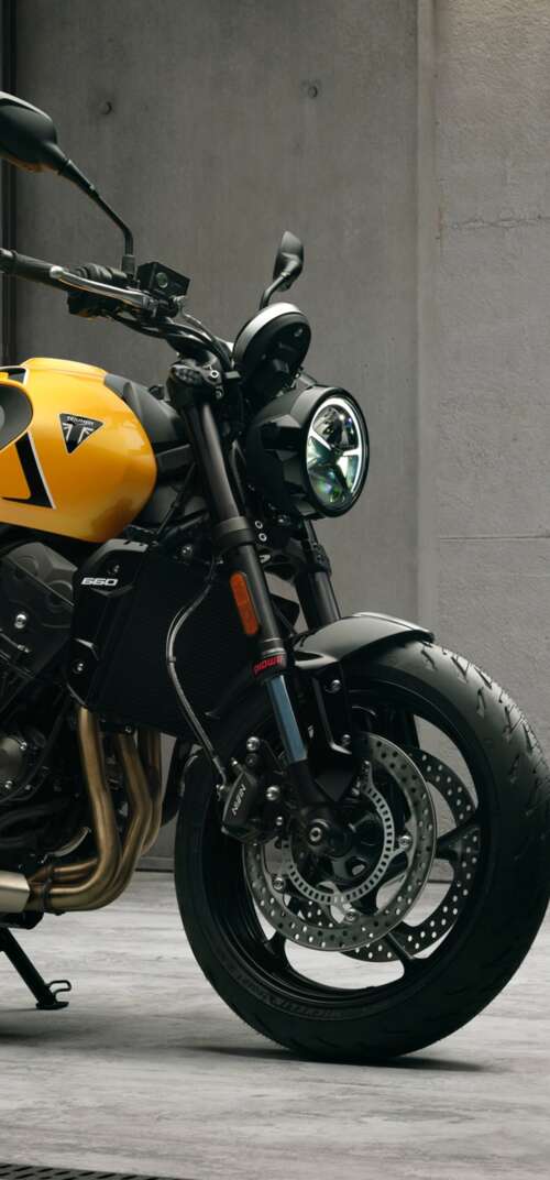 High-detail 5K render of the 2026 Triumph Trident 660 naked motorcycle featuring... Samsung Galaxy S26 Ultra hand phone wallpaper