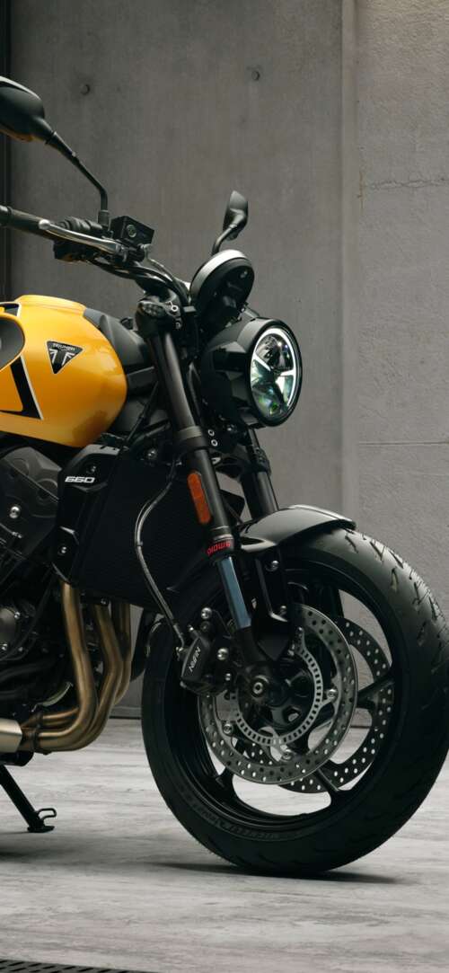 High-detail 5K render of the 2026 Triumph Trident 660 naked motorcycle featuring... Xiaomi Redmi 15 4G cell phone backgrounds free