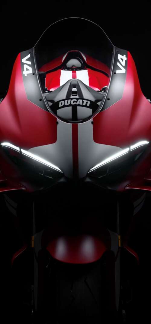 Cinematic close-up of a Ducati Superleggera V4 Centenario sports bike in a dark studio... UmiDigi Umidigi X hd background