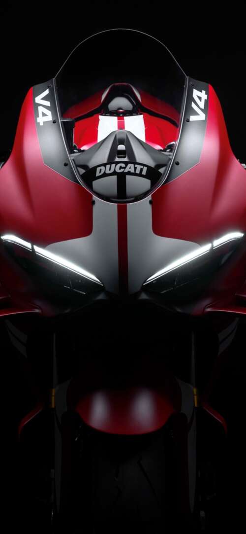 Cinematic close-up of a Ducati Superleggera V4 Centenario sports bike in a dark studio... Xiaomi Redmi 15 4G background images hd