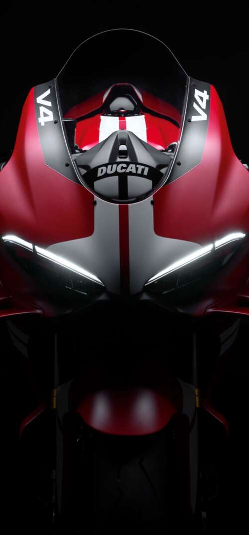 Cinematic close-up of a Ducati Superleggera V4 Centenario sports bike in a dark studio... Samsung Galaxy S26 Ultra free background