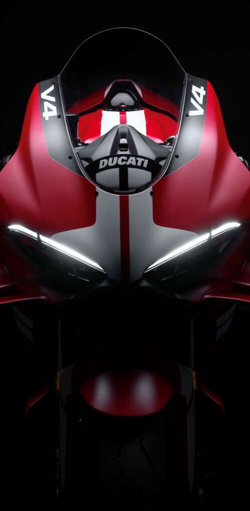 Cinematic close-up of a Ducati Superleggera V4 Centenario sports bike in a dark studio... Huawei Mate 30 Pro hd background