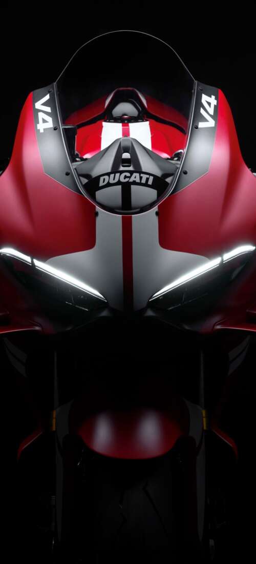 Cinematic close-up of a Ducati Superleggera V4 Centenario sports bike in a dark studio... Oppo Find X9 wallpaper