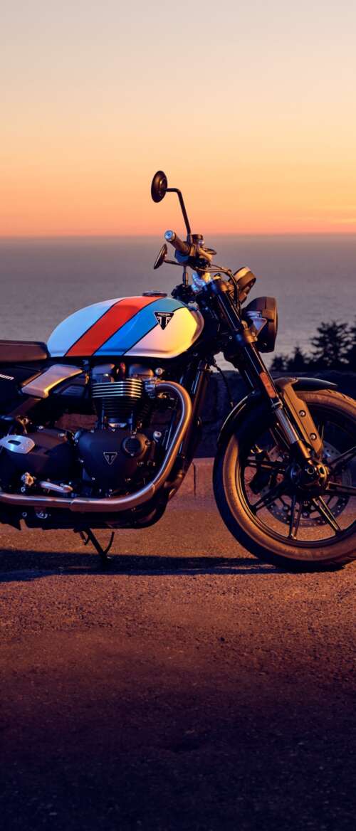 A modern 2025 motorcycle parked against a vibrant sunset sky with warm orange and... nubia Flip 3