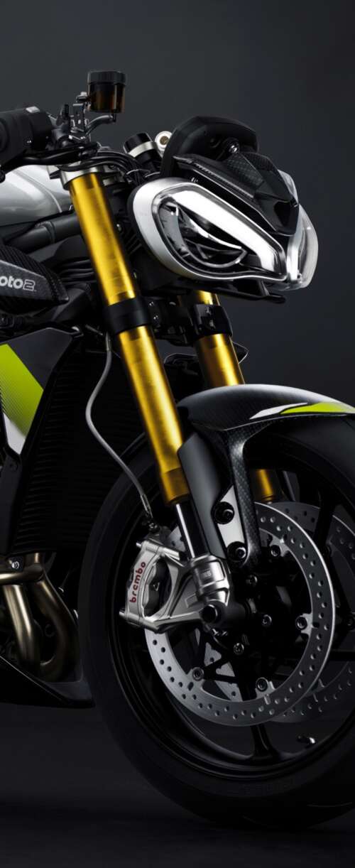 Triumph Street Triple 765 Moto2 Edition motorcycle against a moody dark background Samsung Galaxy Z Flip7 FE hand phone wallpaper