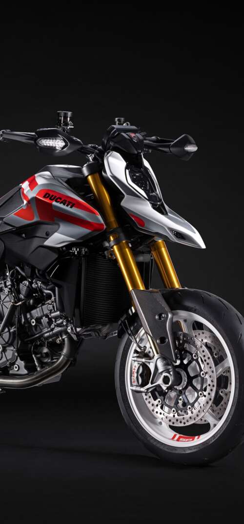 A high-detail 5K cinematic shot of the 2026 Ducati Hypermotard V2 motorcycle featuring... Samsung Galaxy S26 Ultra lock screen wallpaper