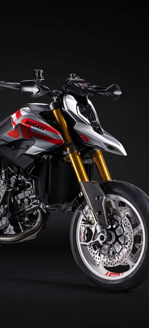 A high-detail 5K cinematic shot of the 2026 Ducati Hypermotard V2 motorcycle featuring... Oppo Find X9 hd background