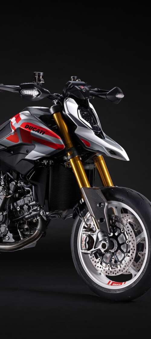 A high-detail 5K cinematic shot of the 2026 Ducati Hypermotard V2 motorcycle featuring... Xiaomi Redmi Note 14S hand phone wallpaper