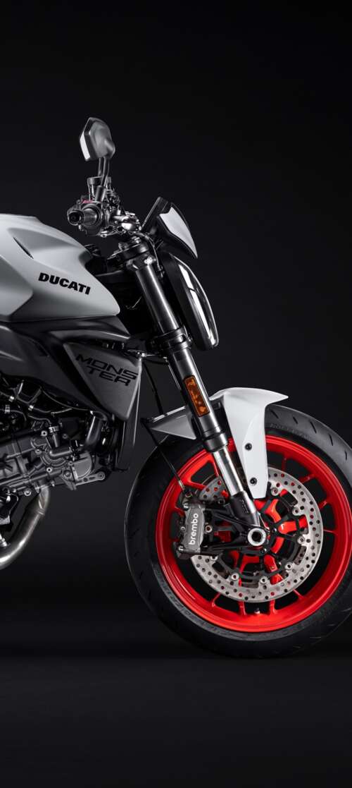 A high-resolution, cinematic close-up of a 2026 Ducati Monster V2 motorcycle set... Infinix Smart 10 cell phone backgrounds free
