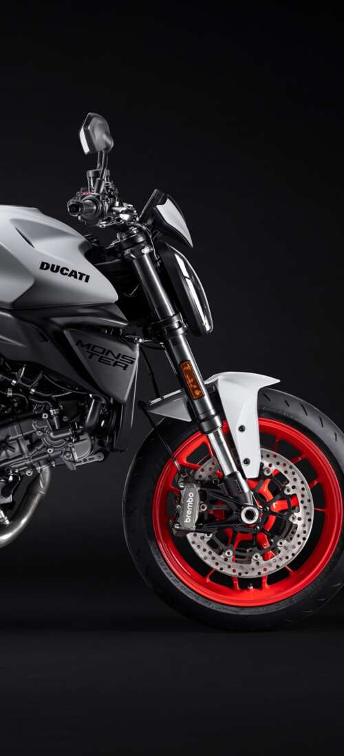 A high-resolution, cinematic close-up of a 2026 Ducati Monster V2 motorcycle set... Oppo Find X9 background images hd