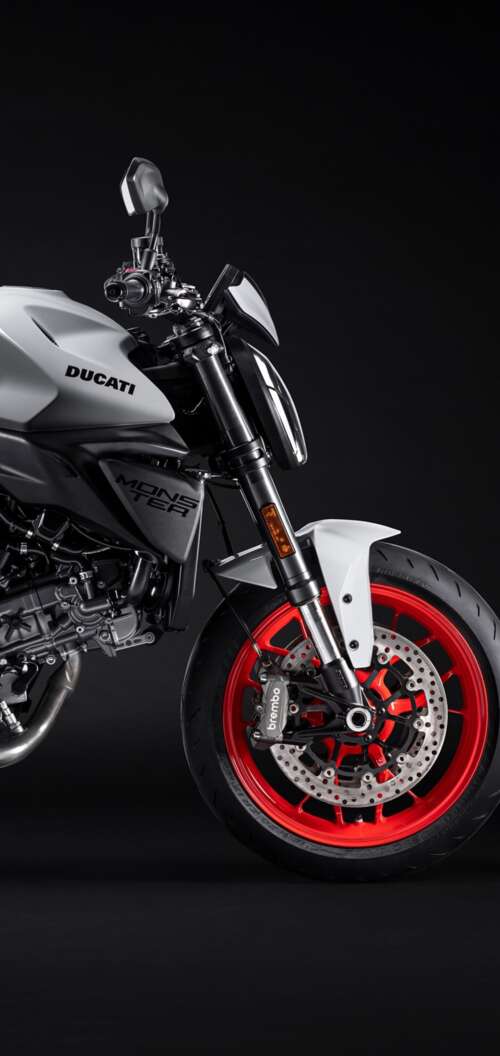 A high-resolution, cinematic close-up of a 2026 Ducati Monster V2 motorcycle set... Oppo A6k 5G cell phone backgrounds free