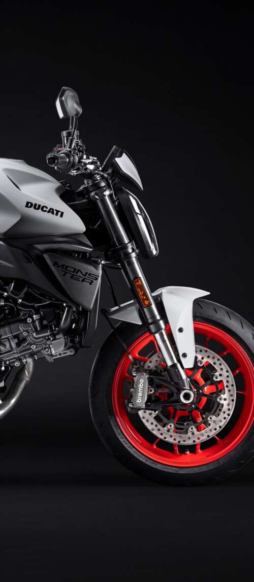 A high-resolution, cinematic close-up of a 2026 Ducati Monster V2 motorcycle set... Xiaomi Redmi 14C 5G wallpaper images