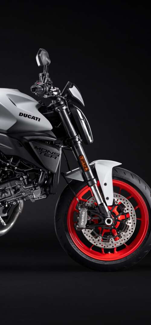 A high-resolution, cinematic close-up of a 2026 Ducati Monster V2 motorcycle set... Samsung Galaxy S26 Ultra free background images