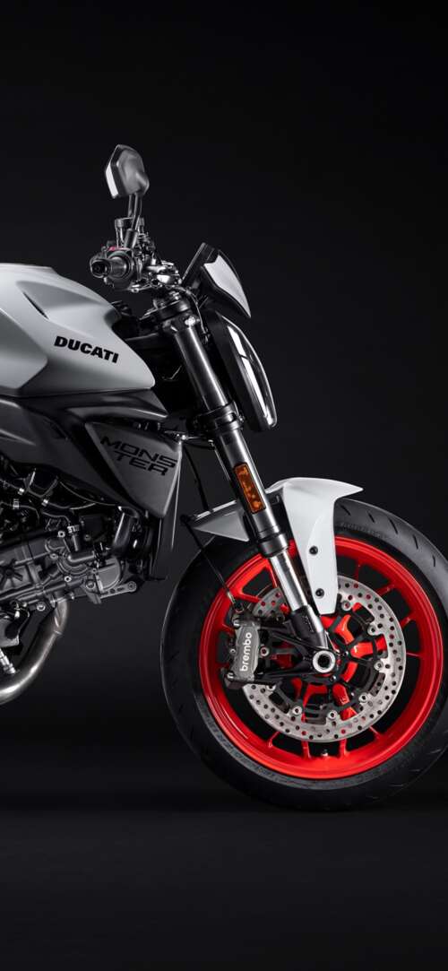 A high-resolution, cinematic close-up of a 2026 Ducati Monster V2 motorcycle set... Xiaomi Redmi 15 4G download free phone wallpaper
