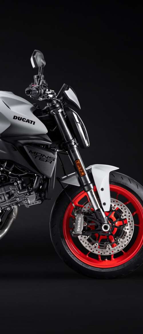 A high-resolution, cinematic close-up of a 2026 Ducati Monster V2 motorcycle set... nubia Flip 3 free background