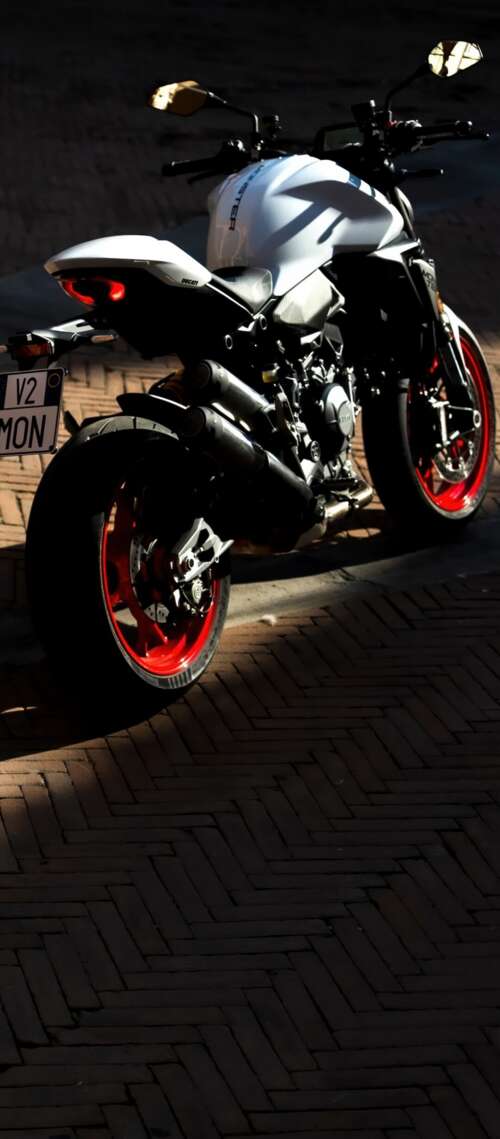 A sleek and futuristic 2026 Ducati Monster V2 sports motorcycle in a high-quality... Blackview XPLORE X1 wallpaper images