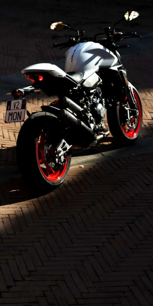 A sleek and futuristic 2026 Ducati Monster V2 sports motorcycle in a high-quality... Ulefone Rugking 2 Pro background images hd