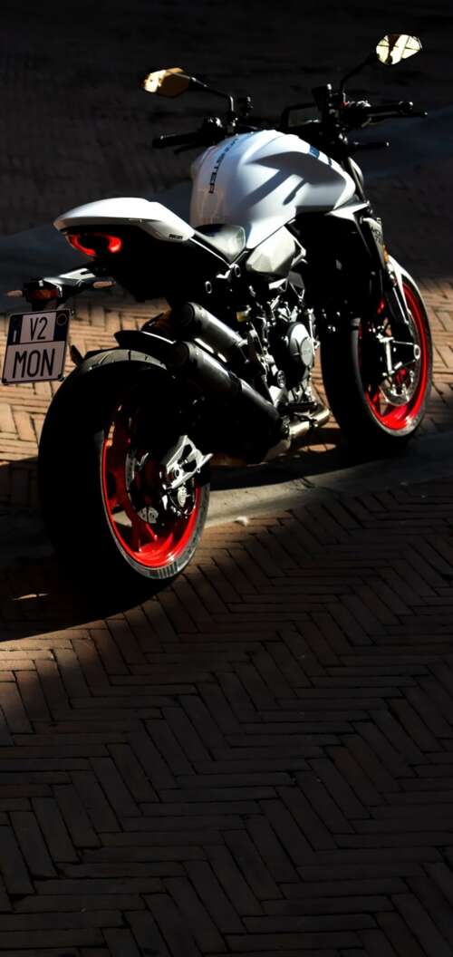 A sleek and futuristic 2026 Ducati Monster V2 sports motorcycle in a high-quality... Oppo A6k 4G wallpaper photo gallery download