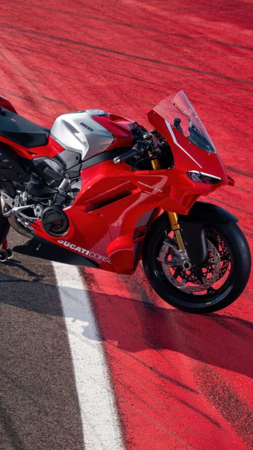A high-resolution, detailed view of a red Ducati Panigale V4 R sports motorcycle. Apple iPhone SE 2022 free wallpaper