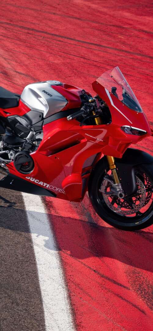 A high-resolution, detailed view of a red Ducati Panigale V4 R sports motorcycle. Xiaomi Redmi 15 4G download free phone wallpaper