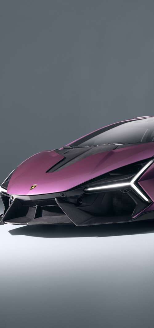 A highly detailed, cinematic shot of the 2026 Lamborghini Revuelto featuring its... download free phone wallpaper