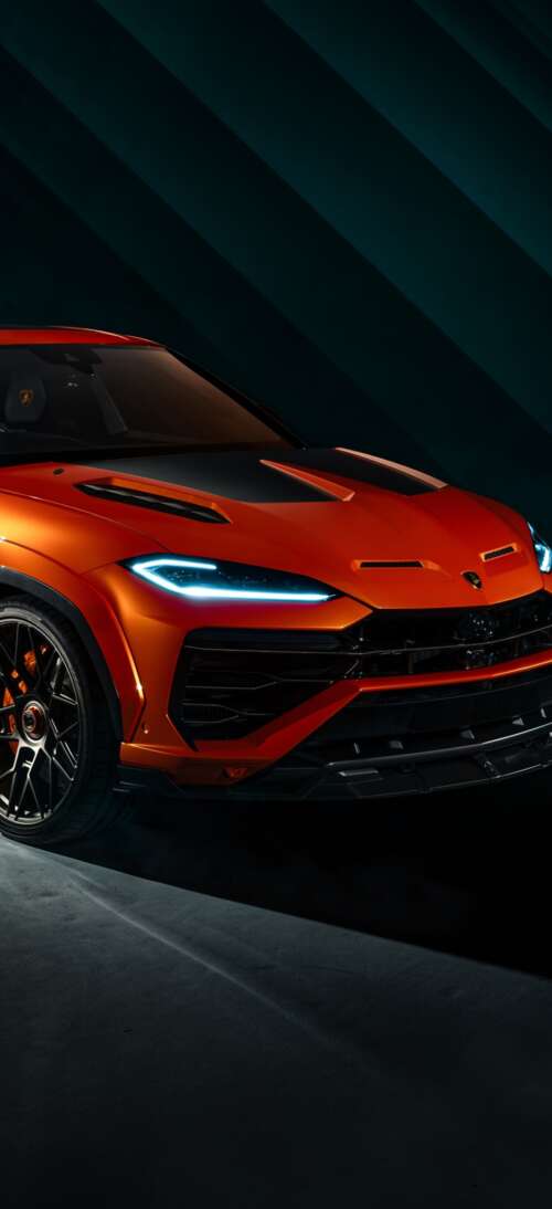 The 2026 Lamborghini Urus SE parked in a dark, cinematic urban environment with dramatic... realme GT 7T cell phone backgrounds free