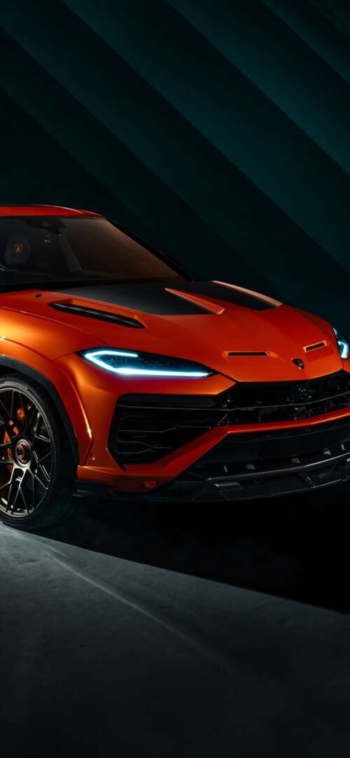 The 2026 Lamborghini Urus SE parked in a dark, cinematic urban environment with dramatic... Xiaomi Redmi 15 4G free wallpaper