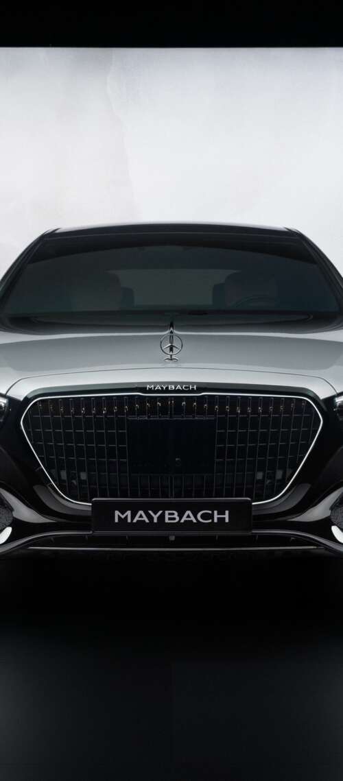 A high-detail, cinematic view of the 2026 Mercedes-Maybach S 580 luxury sedan showcasing... free background