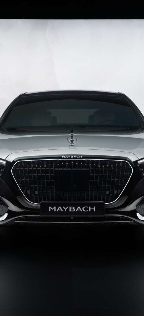 A high-detail, cinematic view of the 2026 Mercedes-Maybach S 580 luxury sedan showcasing... realme GT 7T download free wallpaper for phone