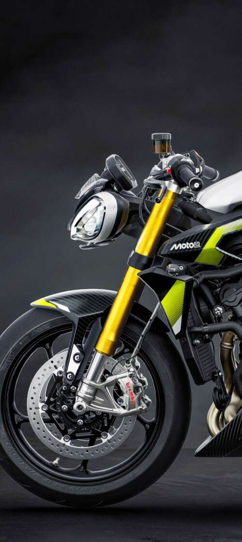 A high-performance 2026 Triumph Street Triple 765 Moto2 Edition motorcycle set against... itel CITY 100 mobile wallpaper
