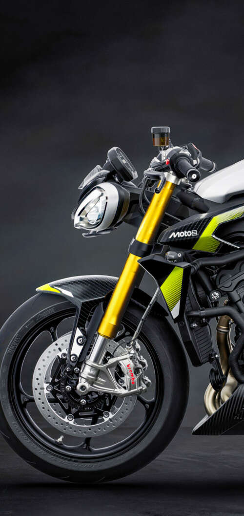 A high-performance 2026 Triumph Street Triple 765 Moto2 Edition motorcycle set against... Oppo A6k 4G mobile wallpaper