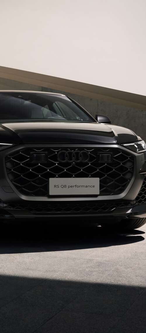 A sleek black Audi RS Q8 luxury performance SUV presented in a high-quality, cinematic... free wallpaper
